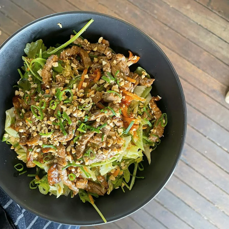 Thai beef salad with fresh greens at Ellen and Rod